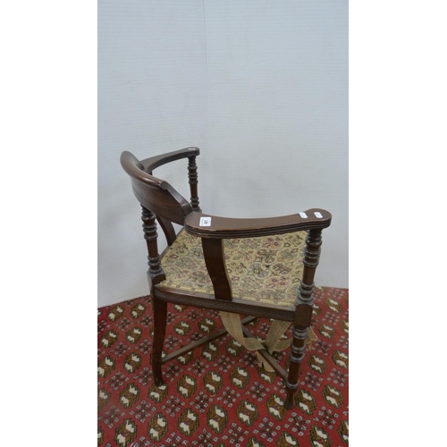 491 - 19th century mahogany corner chair with yoke-shaped back, on turned supports.