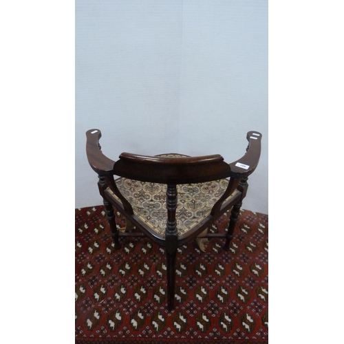 491 - 19th century mahogany corner chair with yoke-shaped back, on turned supports.