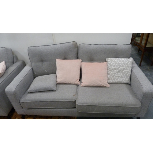 493 - Modern grey fabric upholstered lounge suite comprising two-seat sofa and matching armchair.