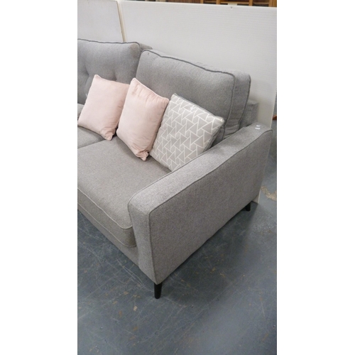 493 - Modern grey fabric upholstered lounge suite comprising two-seat sofa and matching armchair.