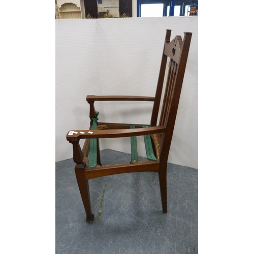 496 - Art Nouveau oak-framed carver armchair with heart-shaped pierced top rail and tulip spars, on square... 