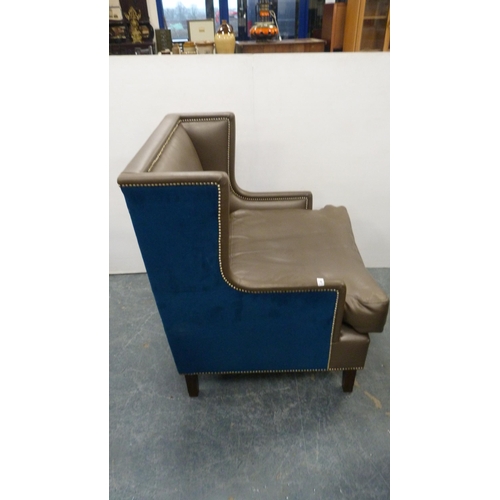 499 - Contemporary wing armchair upholstered in blue velour and hide.