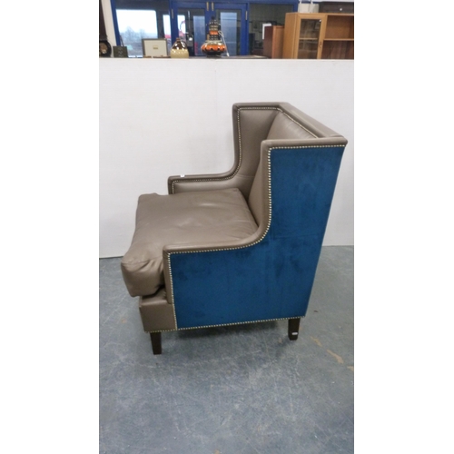 499 - Contemporary wing armchair upholstered in blue velour and hide.