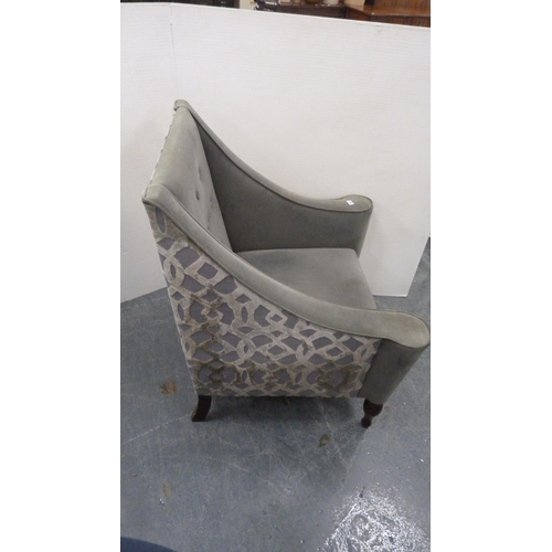 500 - Contemporary button-back armchair upholstered in grey.