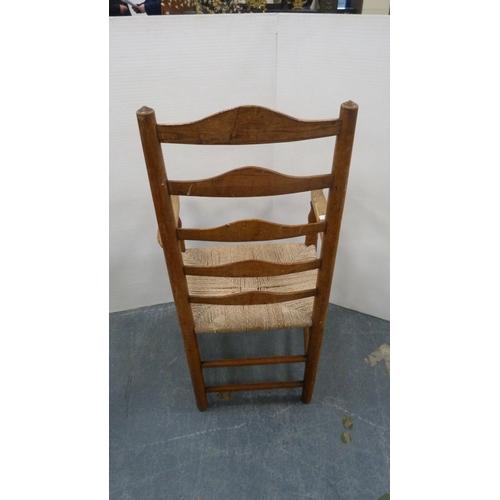 501 - Ash and elm ladder-back carver chair, c. early 20th century, with woven seat, on turned supports and... 