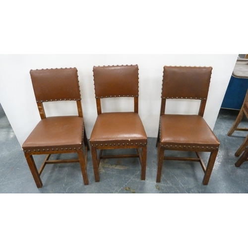 502 - Near-set of thirty oak English dining chairs, c. 1950s, with studded upholstery, stamped to the unde... 