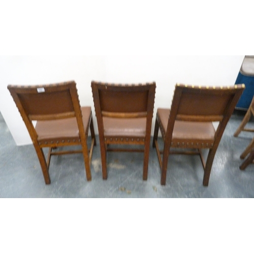 502 - Near-set of thirty oak English dining chairs, c. 1950s, with studded upholstery, stamped to the unde... 