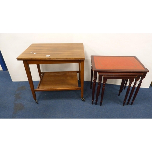 505 - Walnut fold-over tea trolley and a nest of three tables.