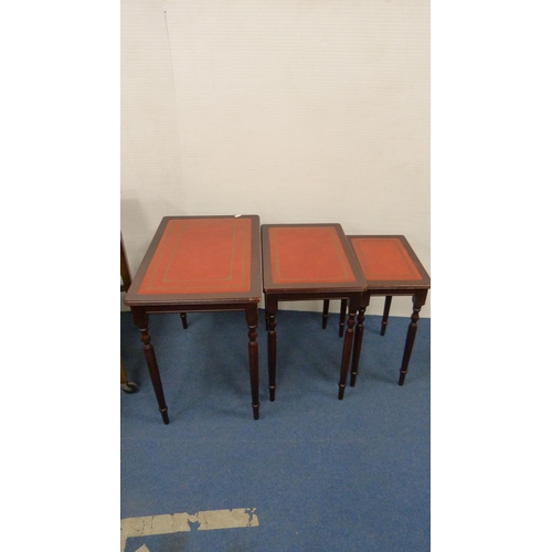 505 - Walnut fold-over tea trolley and a nest of three tables.