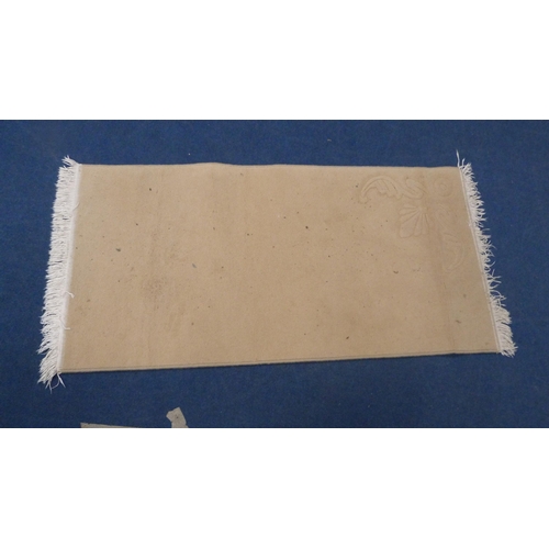 514 - Chinese beige ground fringed rug, 154cm x 76cm.