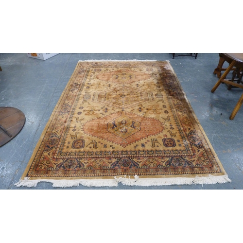 515 - Tabriz style beige ground hand knotted rug decorated with animals, 280cm x 180cm.