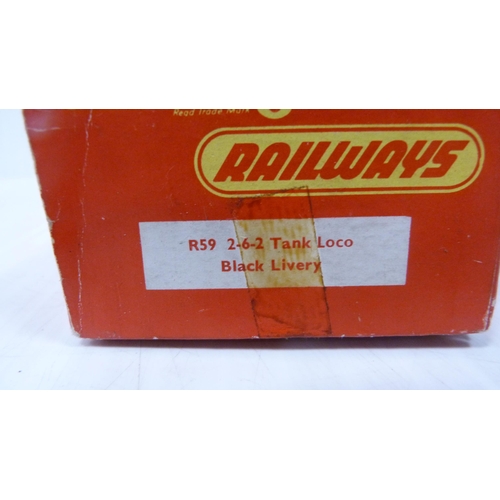 54 - Boxed Tri-ang OO gauge R59 tank loco, another boxed Tri-ang loco, four loose locos, tender and two c... 