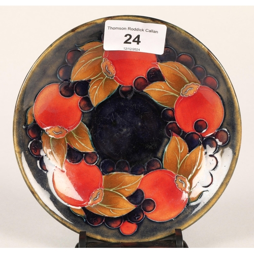 24 - Moorcroft pottery saucer in pomegranate design