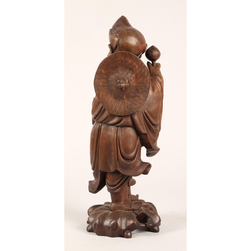 46 - Oriental carved root wood figure, 37cm h