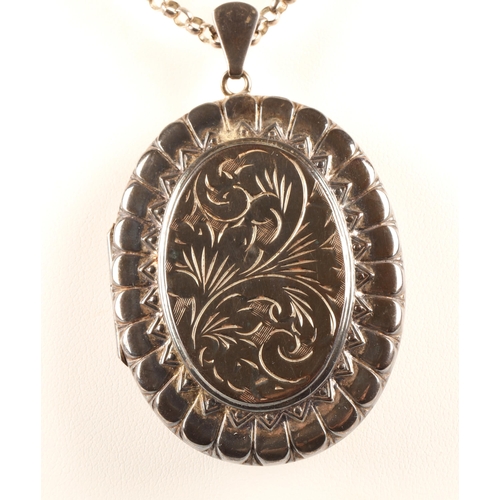 63 - Large silver locket on chain, 34.6g