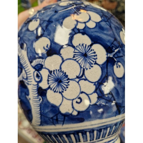 15 - Gourd shaped blue and white oriental vase, 32cm h