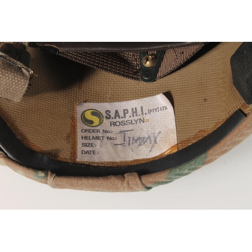 224 - British army helmet with label 'S.A.P.H.I. (PTY) LTD Rosslyn' label penned 'Jimmy', cloth camouflage... 