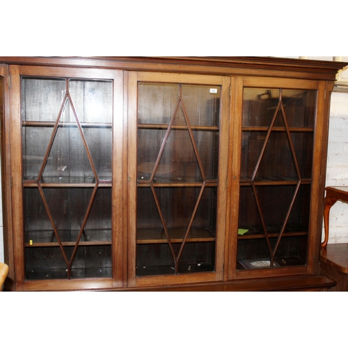 882 - Victorian mahogany astragal glazed cabinet bookcase, the three glazed doors above three frieze drawe... 