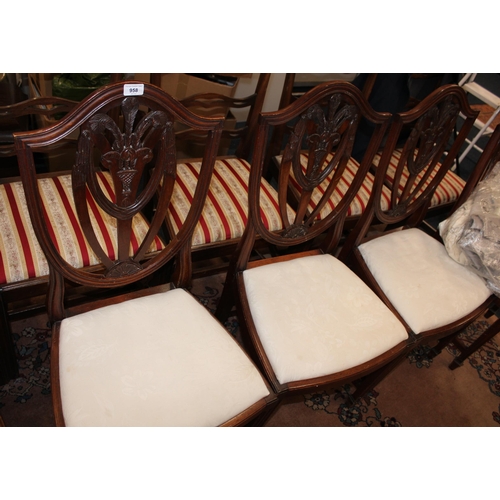 958 - Set of four mahogany shield back dining chairs.