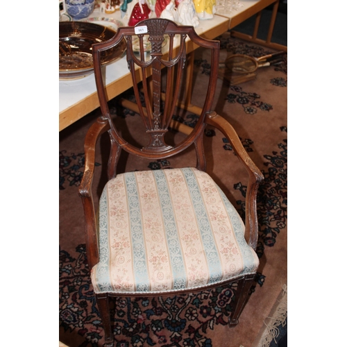 961 - Antique mahogany open armchair with swag decorated shield back.