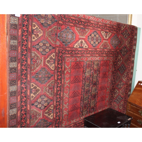 964 - Red ground multi border fringed rug with geometric design, 198cm wide x 310cm long