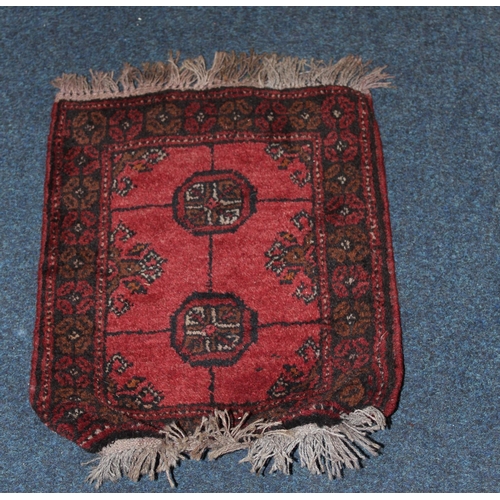 970 - Orange ground rug with geometric decoration, a beige ground rug and a red ground prayer matt. (3)