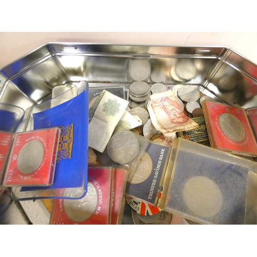 416 - Tin of commemorative World coins and bank notes.