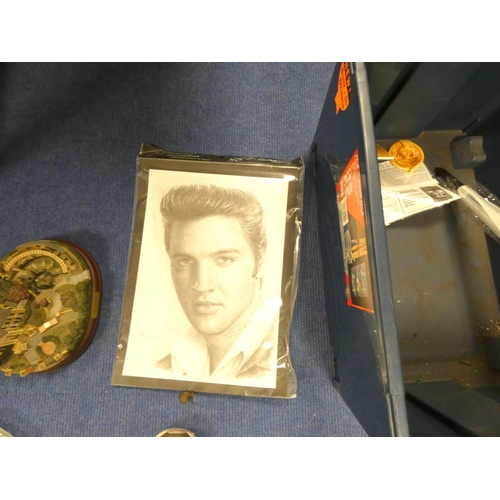 516 - Large box of Elvis memorabilia including records, t-shirts, mugs etc.