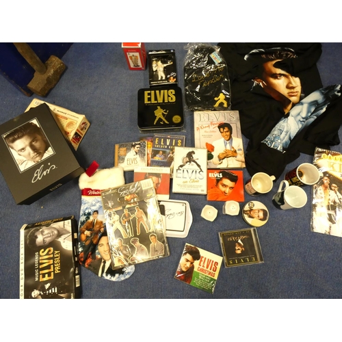 516 - Large box of Elvis memorabilia including records, t-shirts, mugs etc.