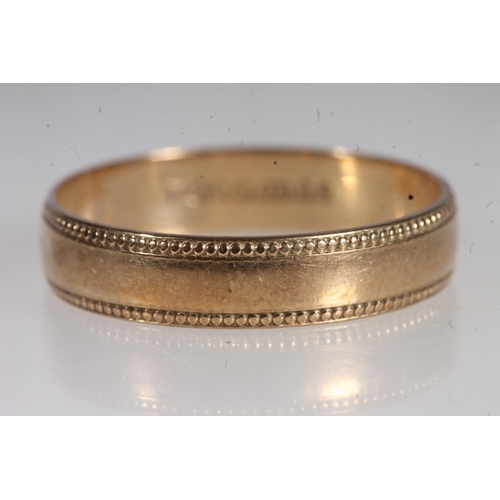 706 - 9ct yellow gold band with patterned edges, maker B Bros., 1.5g.