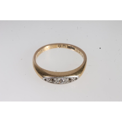 707 - 18ct gold illusion set three stone diamond ring, 2.7g.