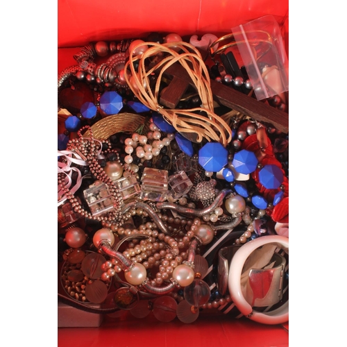 712 - Box containing costume jewellery to include bangles, necklaces etc.