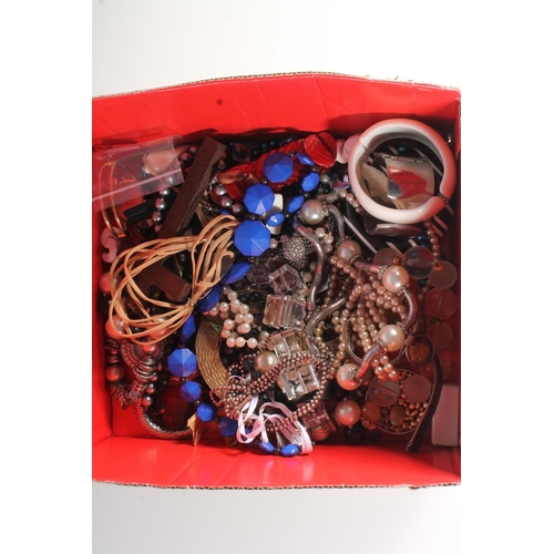 712 - Box containing costume jewellery to include bangles, necklaces etc.