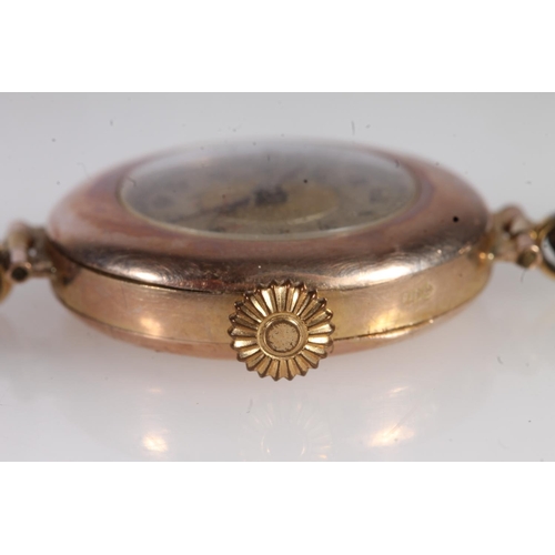 724 - 9ct gold cased ladies wristwatch on antique leather strap.