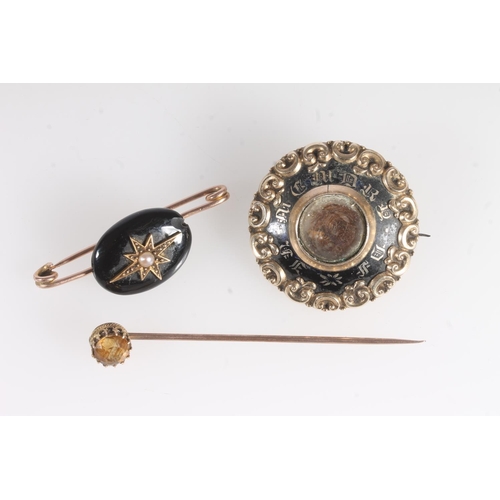 725 - 9ct gold mourning brooch set with pearl, another Victorian mourning brooch, and a 9ct gold stick pin... 