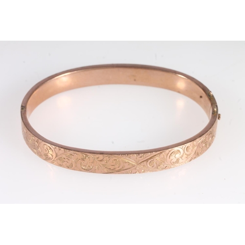 736 - Victorian 9ct gold floral decorated snap shut bangle, 11.8g.