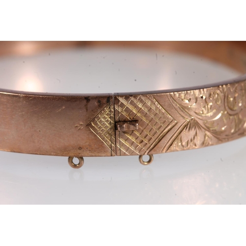 736 - Victorian 9ct gold floral decorated snap shut bangle, 11.8g.