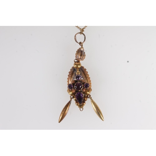 746 - Yellow metal necklace with amethyst set pendant.