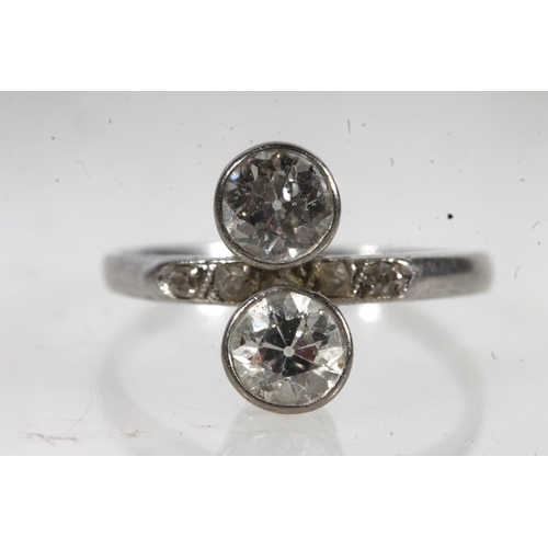 777 - White metal two stone dress ring (not diamonds).