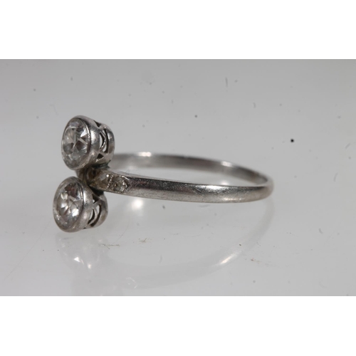 777 - White metal two stone dress ring (not diamonds).