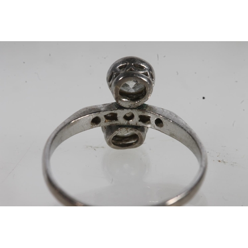 777 - White metal two stone dress ring (not diamonds).