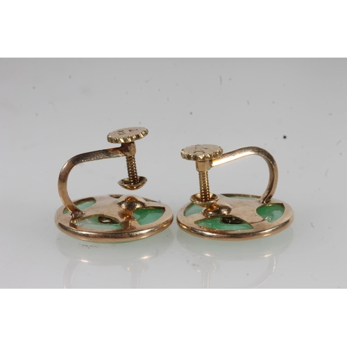 783 - A pair of Chinese jade earrings set in yellow metal, 4.9g.