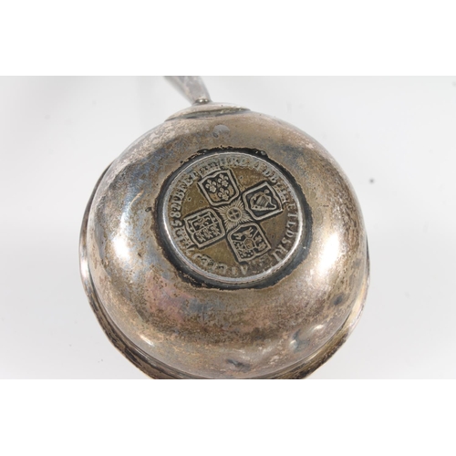 827 - Antique silver balleen handled toddy lift, the bowl with central silver coin.