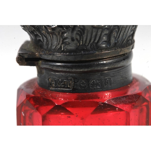 828 - Two Victorian silver mounted & cranberry glass scent bottle, one double ended.