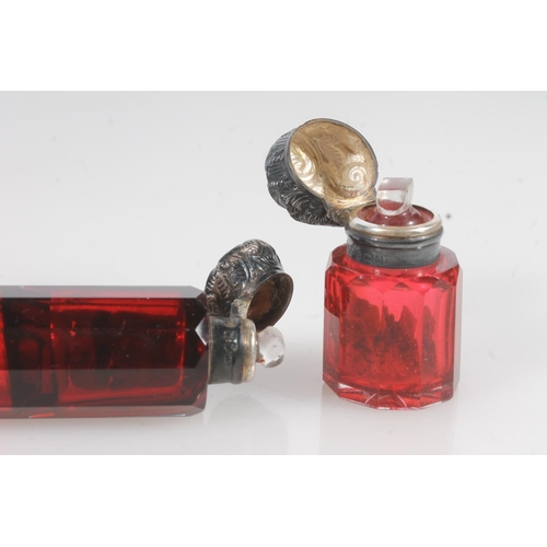 828 - Two Victorian silver mounted & cranberry glass scent bottle, one double ended.