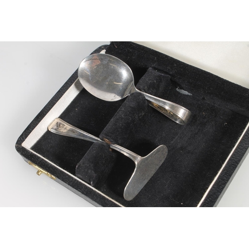 845 - Cased silver spoon and pusher set, silver napkin ring and a silver spoon etc, 73g.