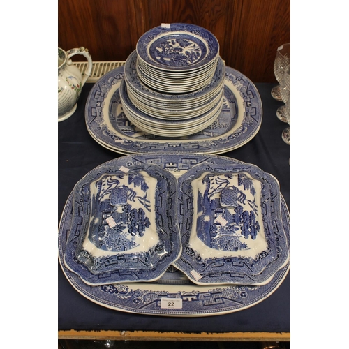 22 - Early 20th century Staffordshire Willow pattern blue and white dinnerware to include meat platters, ... 