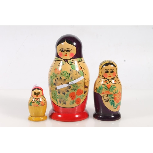 44 - Three Russian Matryoshka nesting dolls.