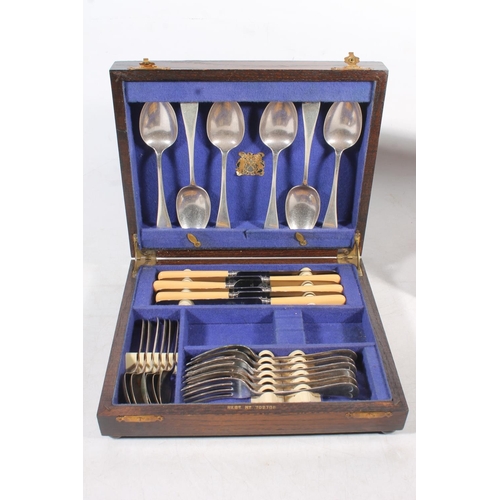 47 - Vintage tin and a canteen of cutlery.