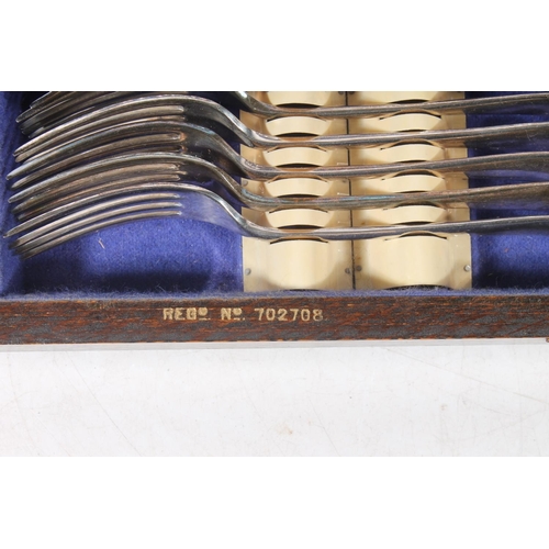 47 - Vintage tin and a canteen of cutlery.